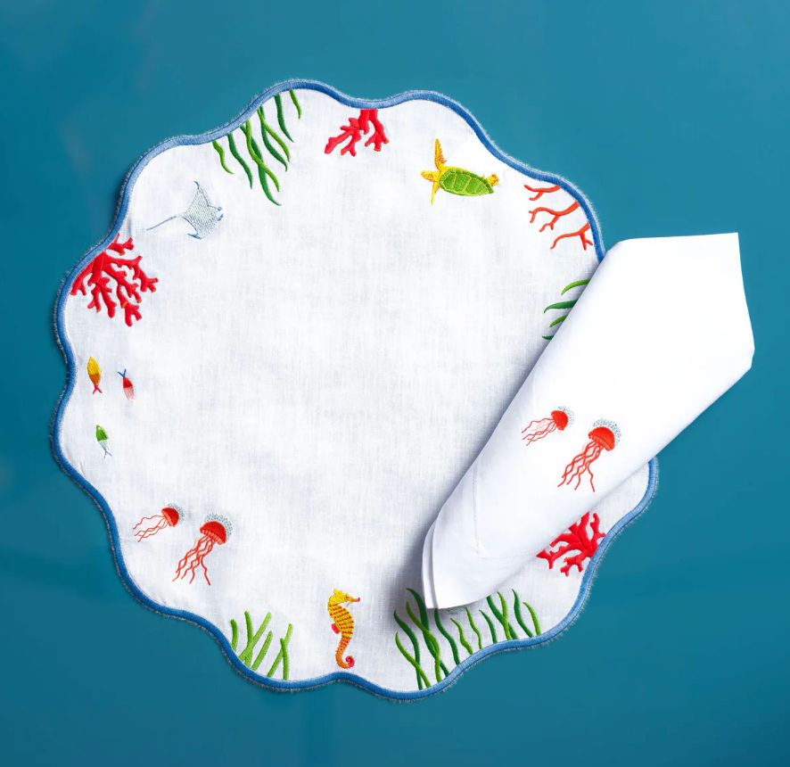 Hand-embroidered under-the-sea linen placemat and napkin by Maison Alia