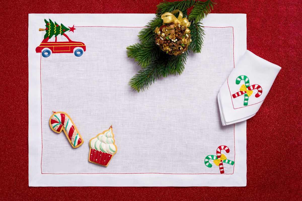 Close-up of Christmas Joy festive embroidery on white linen
