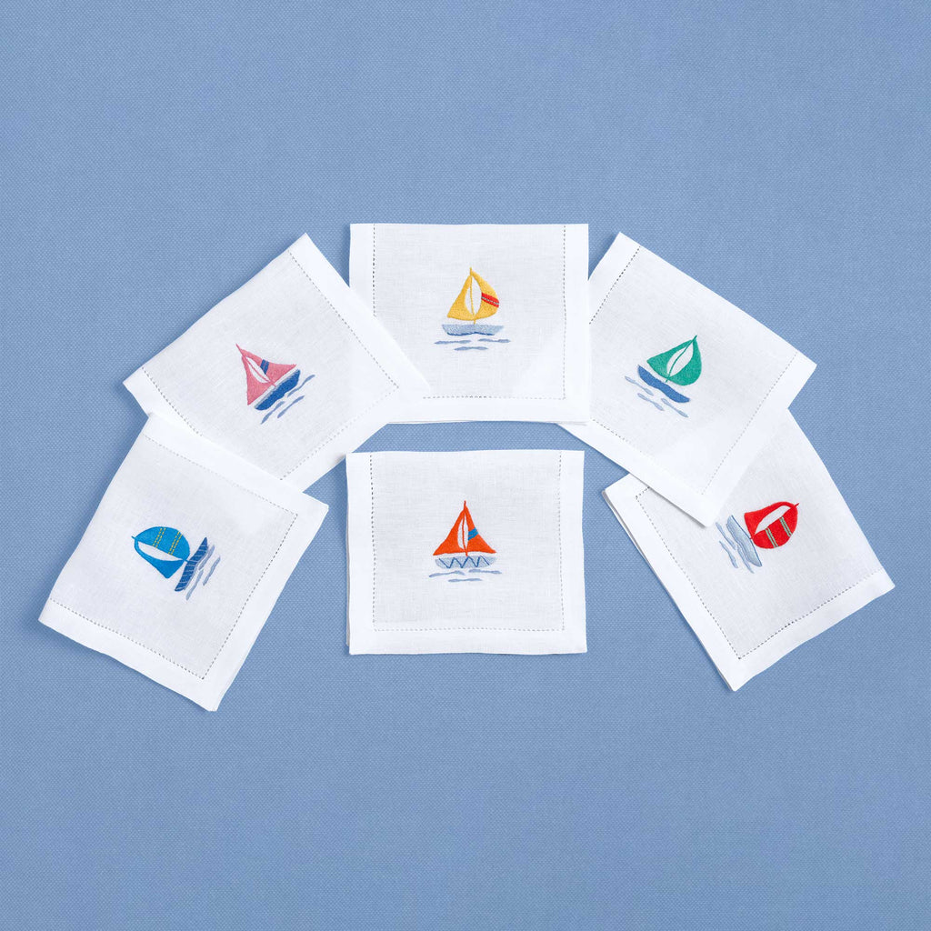 Colored Sailboats embroidered sailboat detail on white linen