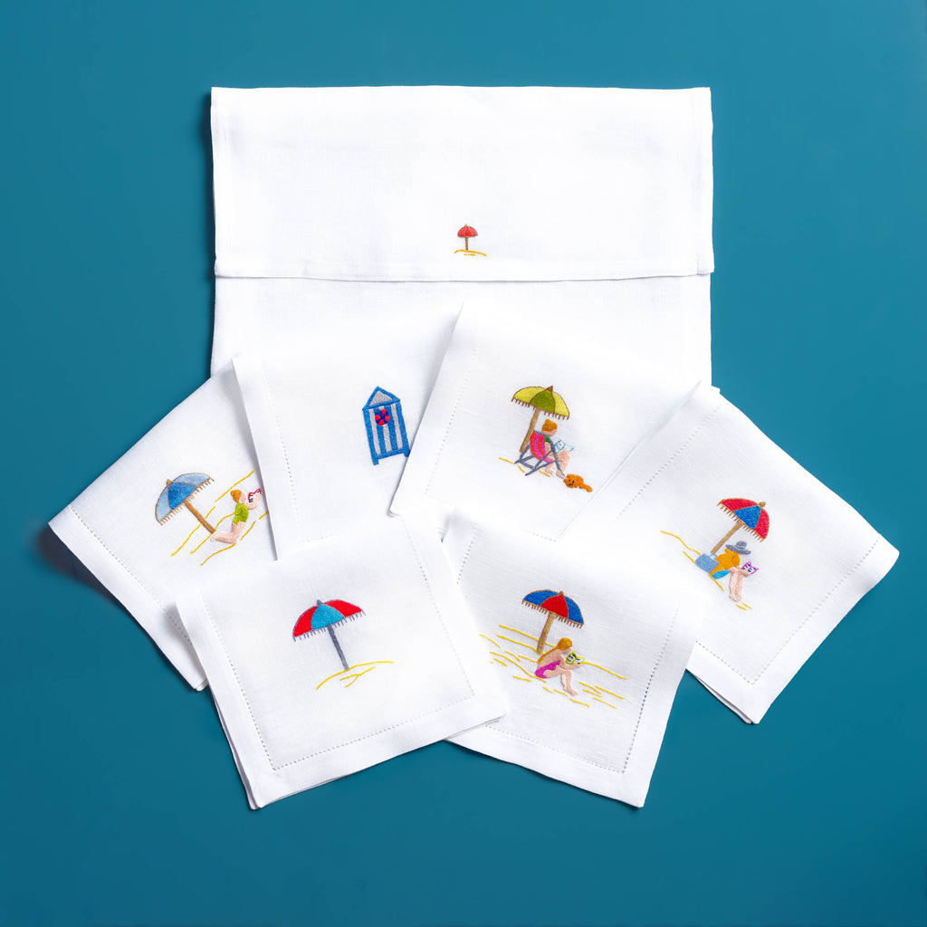 Close-up of Deauville embroidery on white linen cocktail napkin