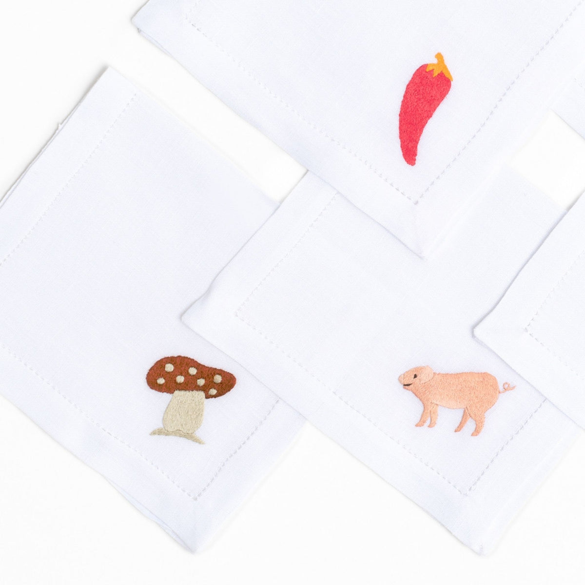 Lucky Charms embroidered charm on white linen cocktail napkin