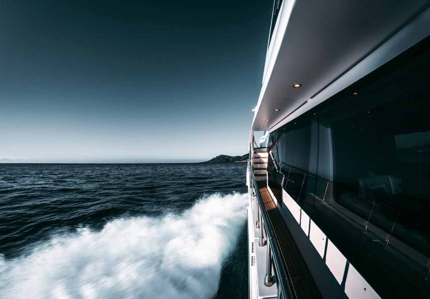 Sea view from the deck of a luxury yacht outfitted with Maison Alia bespoke linen