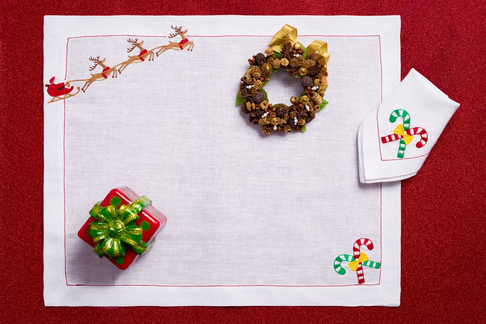 Reindeer Magic (Placemat + Napkin) — hand-embroidered Italian linen placemat & napkin set | Maison Alia