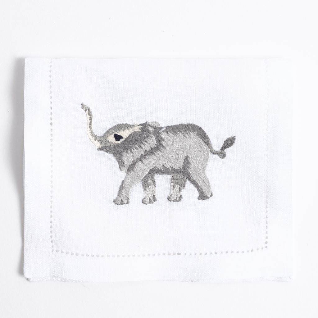 Savanna embroidered animal motif on white linen cocktail napkin
