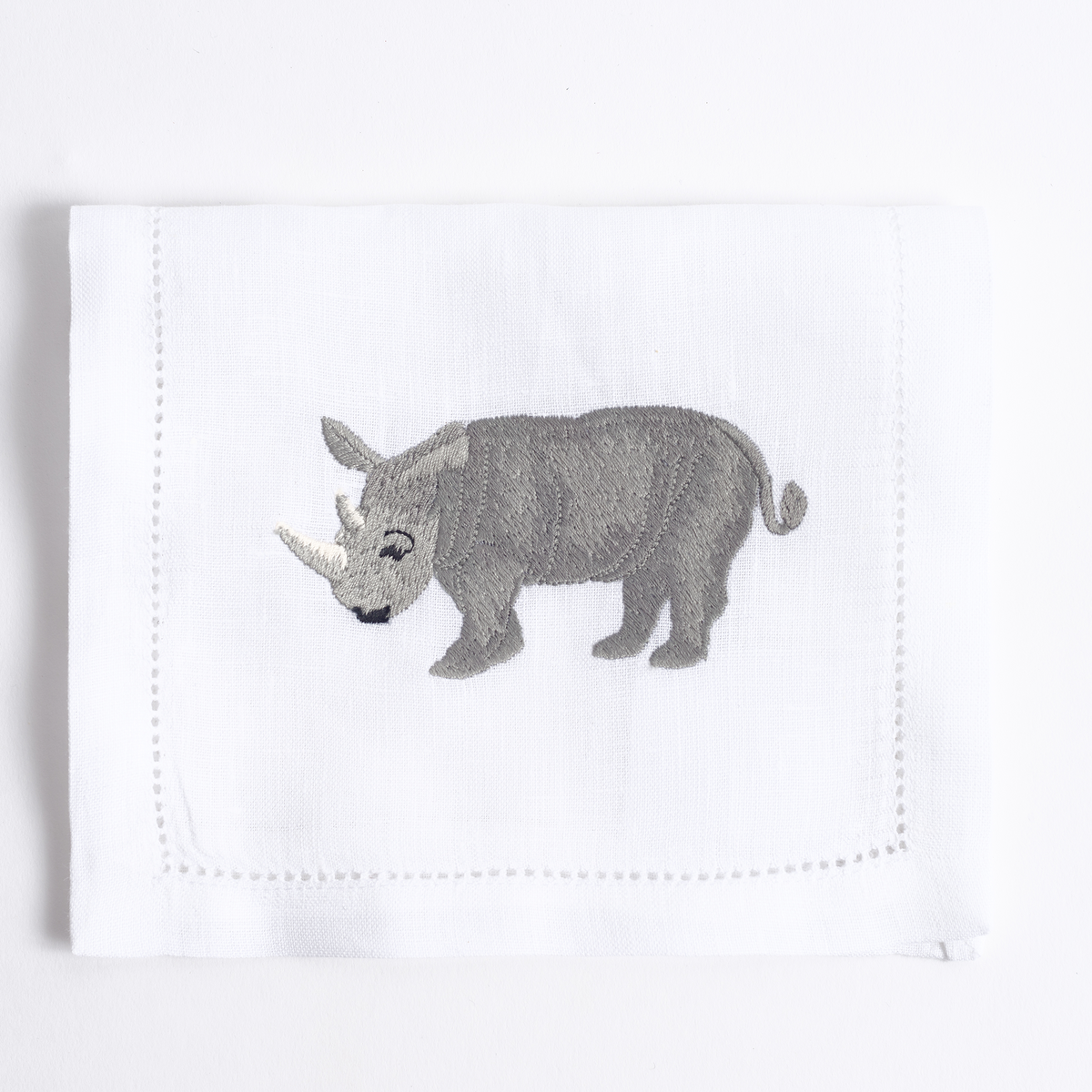 Savanna embroidered safari animal detail on white linen cocktail napkin