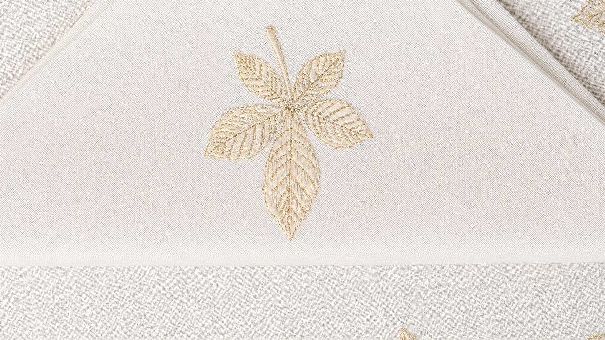 Sottobosco embroidered autumn woodland detail on white linen