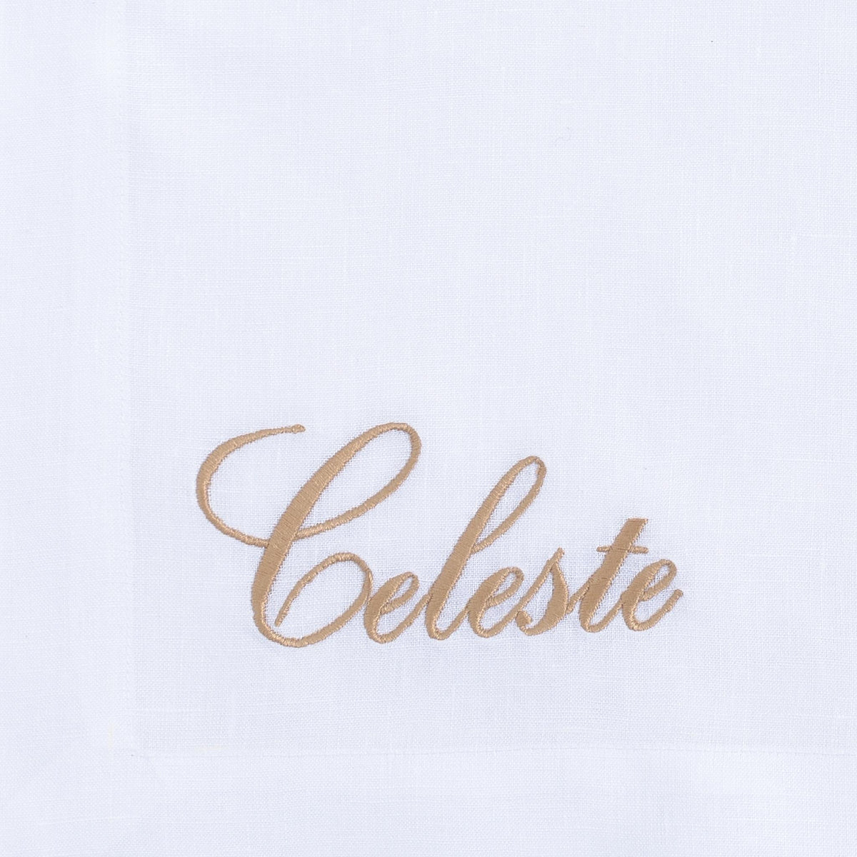 Close-up of embroidered cheetah on white linen — Maison Alia