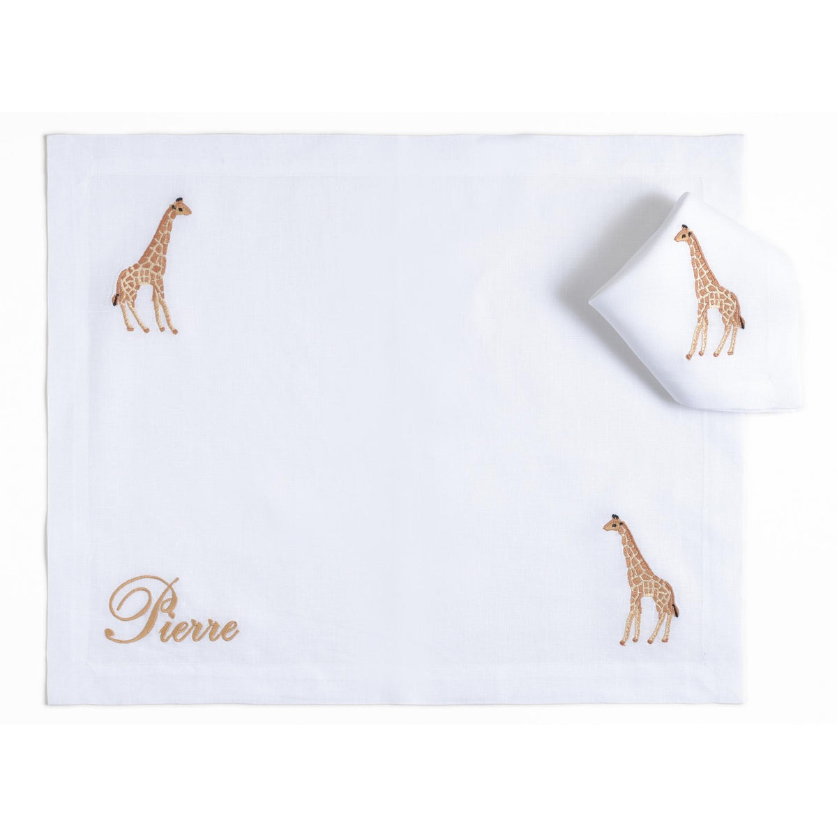 Embroidered giraffes on a white linen children's placemat — Maison Alia