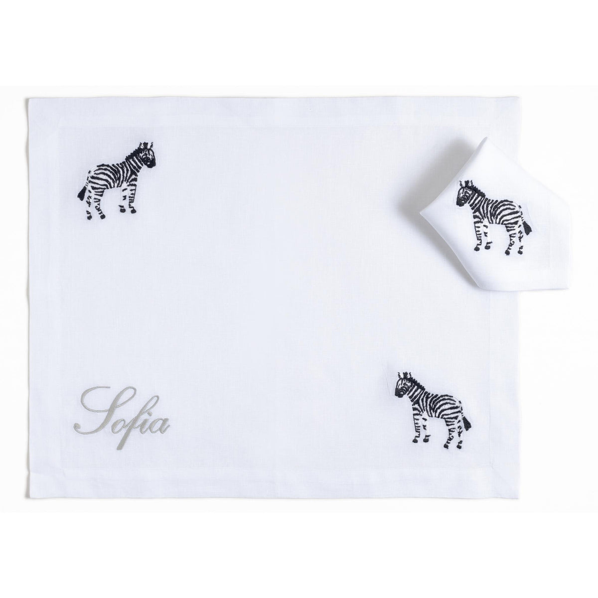 Embroidered zebra on a white linen children's placemat — Maison Alia